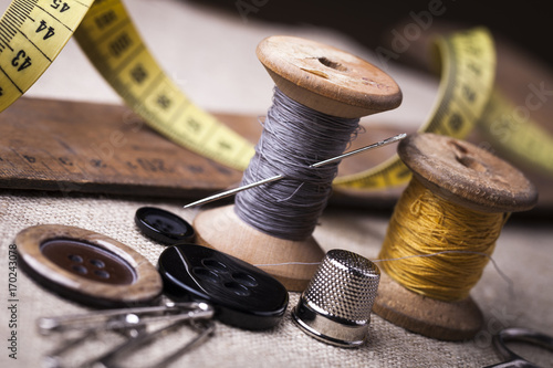 Fototapeta Sewing instruments, threads, needles, bobbins and materials.