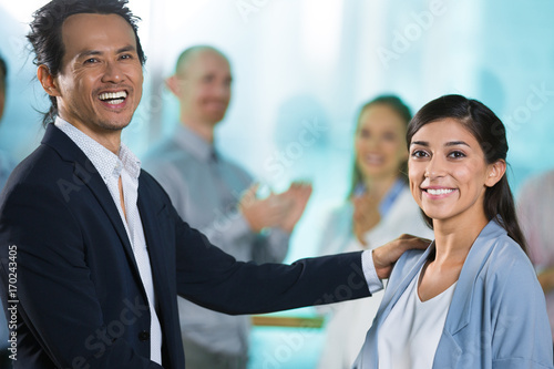 Fotografija Excited boss congratulating woman with promotion