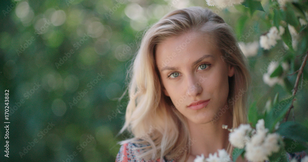 Woman in spring blossom. Young naturally beautiful woman near the blooming tree in spring time. Eco beauty and health concept. Woman in spring blossom. Young naturally beautiful woman near the blooming tree in spring time. Eco beauty and health concept.