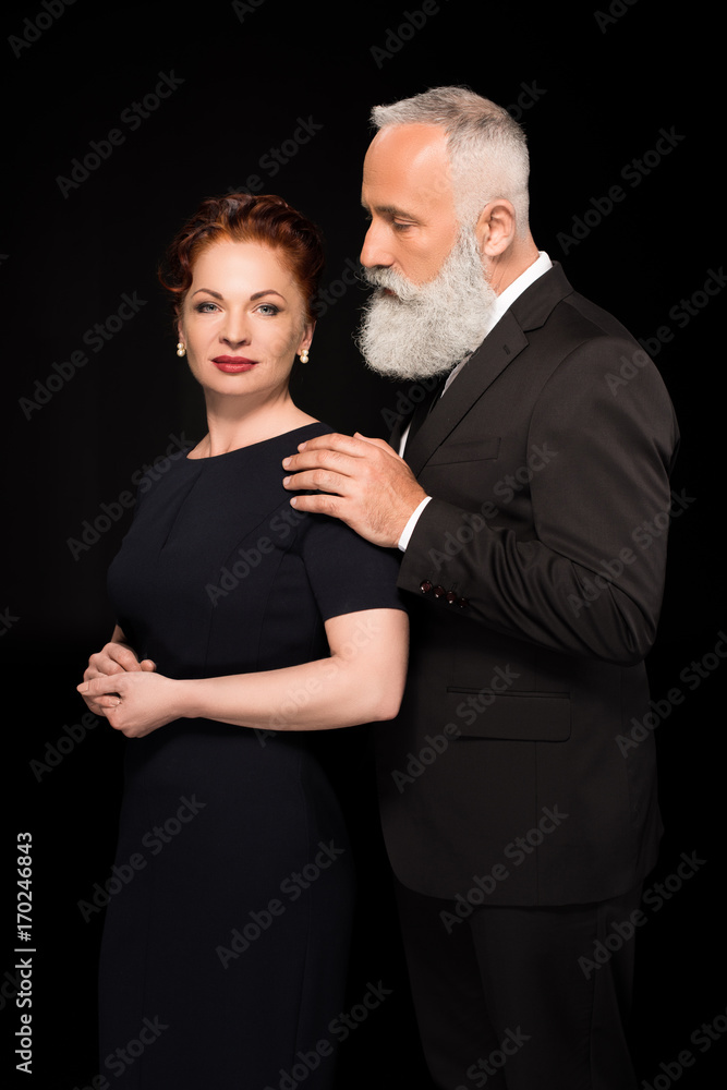 man touching woman on shoulder man touching woman on shoulder