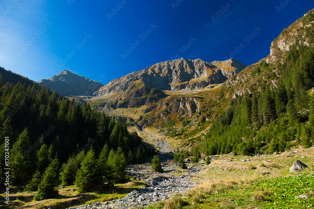 Landscape in mountains with the dark blue sky