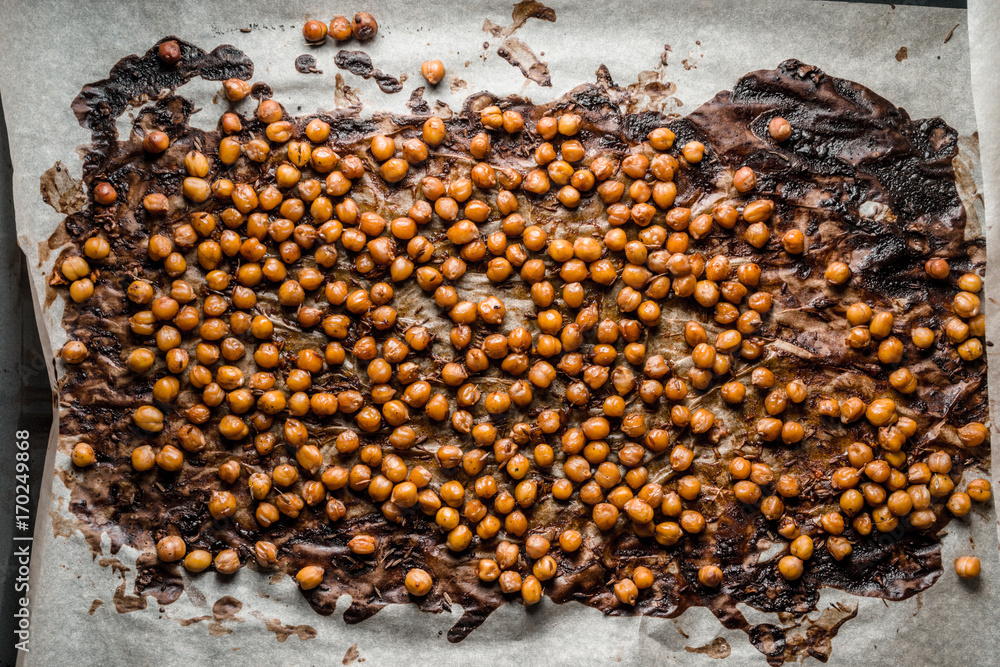 Nut in caramel crust on parchment and baking Nut in caramel crust on parchment and baking