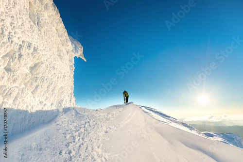 People on the top of the winter mountain