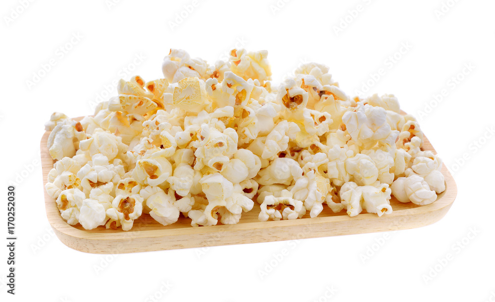 Pop corn in wood plate  isolated on white background