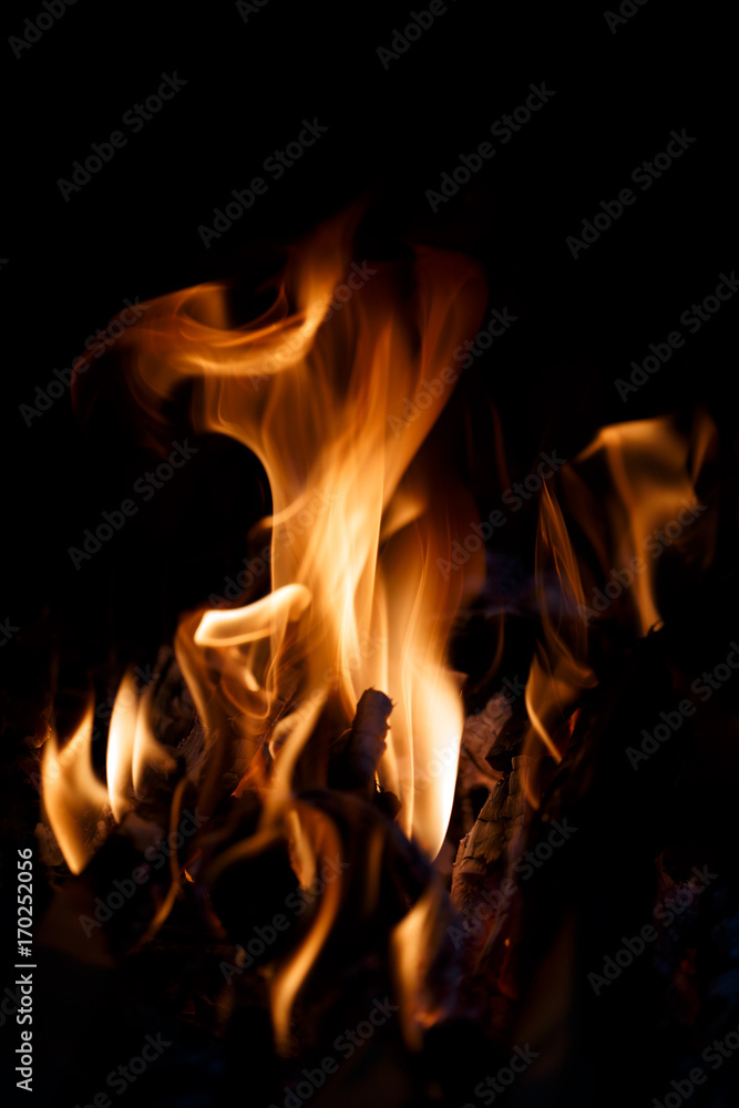 Shaped flame of fire isolated on a black background.