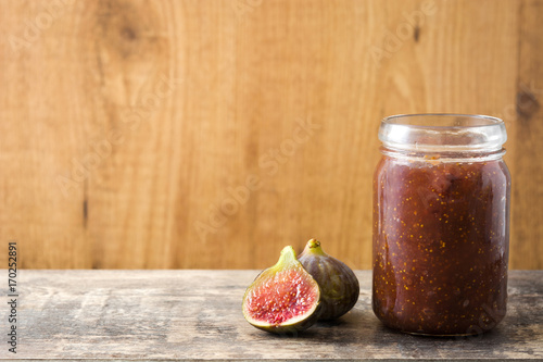 Sweet fig jam on wooden table
