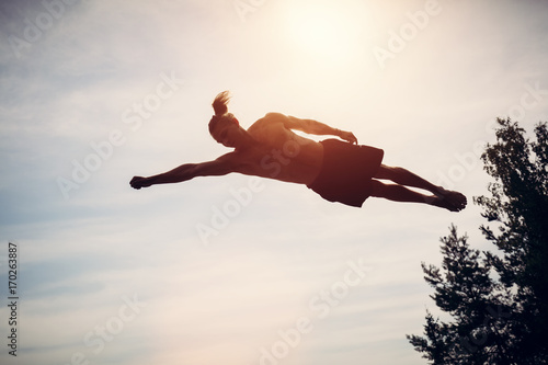 Bilde på lerret Young man levitating in the air.