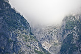 Rocky slope of a mountain partly covered by mist in the Tennen range in the Austrian Alps near the town of Werfen
