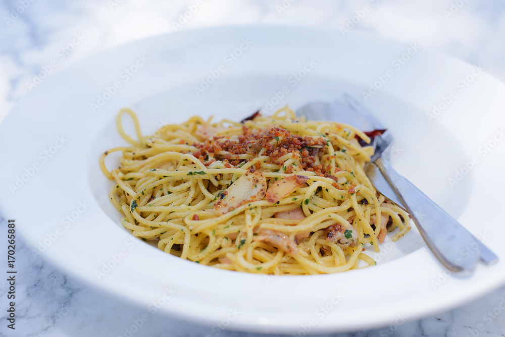 Spaghetti carbonara with ham in white plate - Italian food style Spaghetti carbonara with ham in white plate - Italian food style