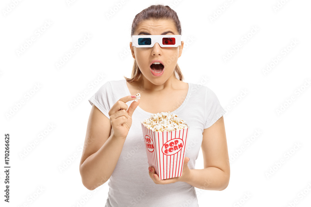 Fototapeta premium Scared girl with 3D glasses and popcorn