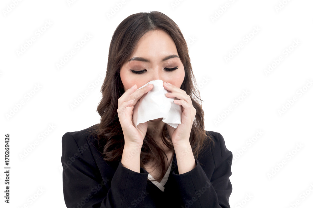 Sick woman blowing her nose with tissues isolated on white background Sick woman blowing her nose with tissues isolated on white background