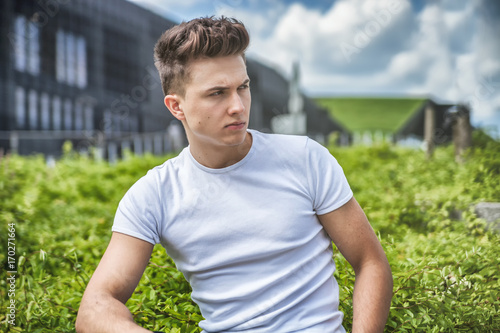 Handsome young man on walk in city