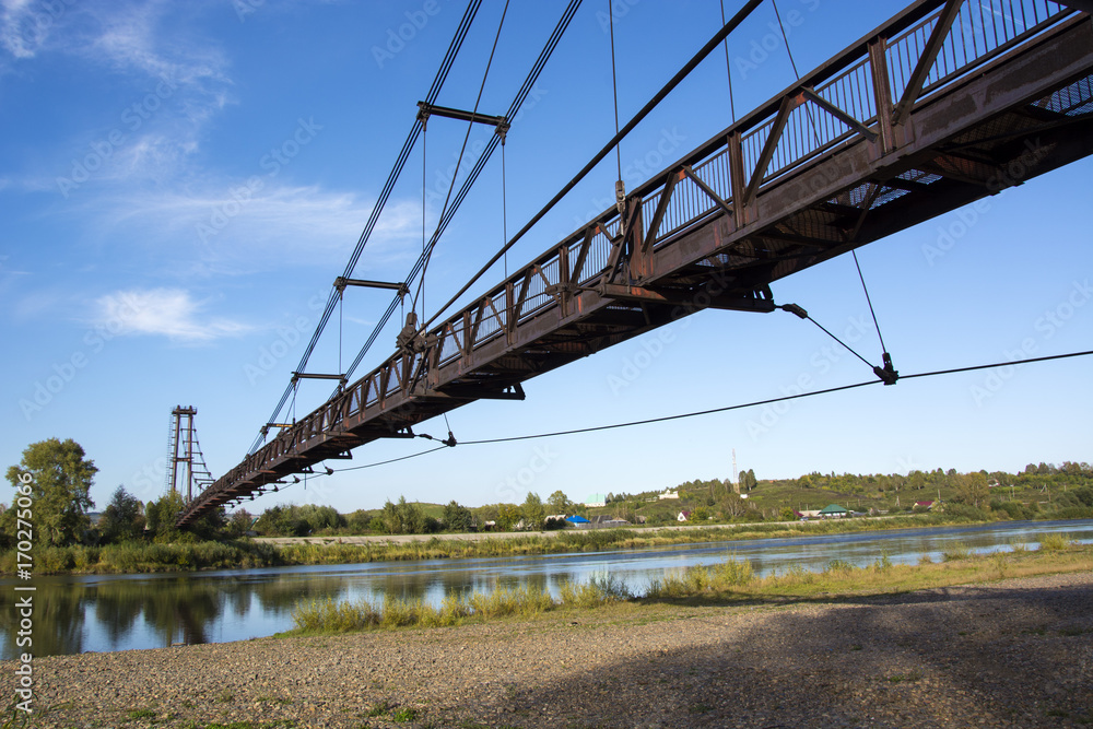 the river Kondoma,suspension bridge,Russia