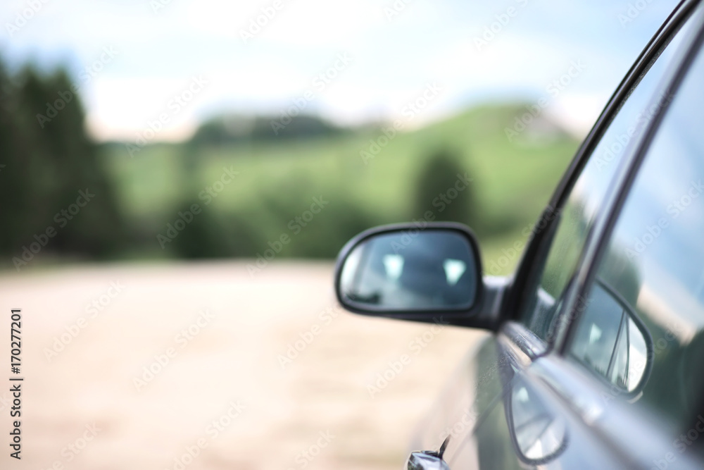 car on the country road in summer
