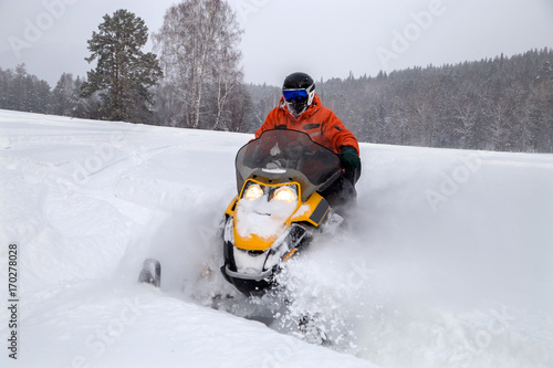 Athlete on a snowmobile