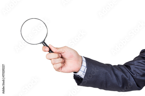 Businessman holding magnifying glass isolated on white background
