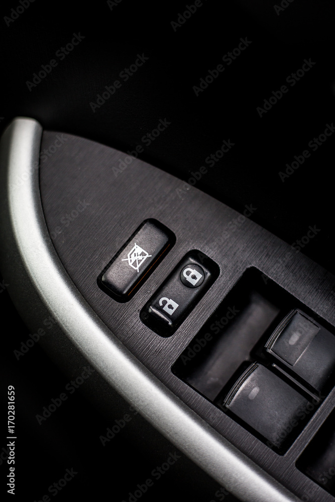 Close up Power door control button on car.