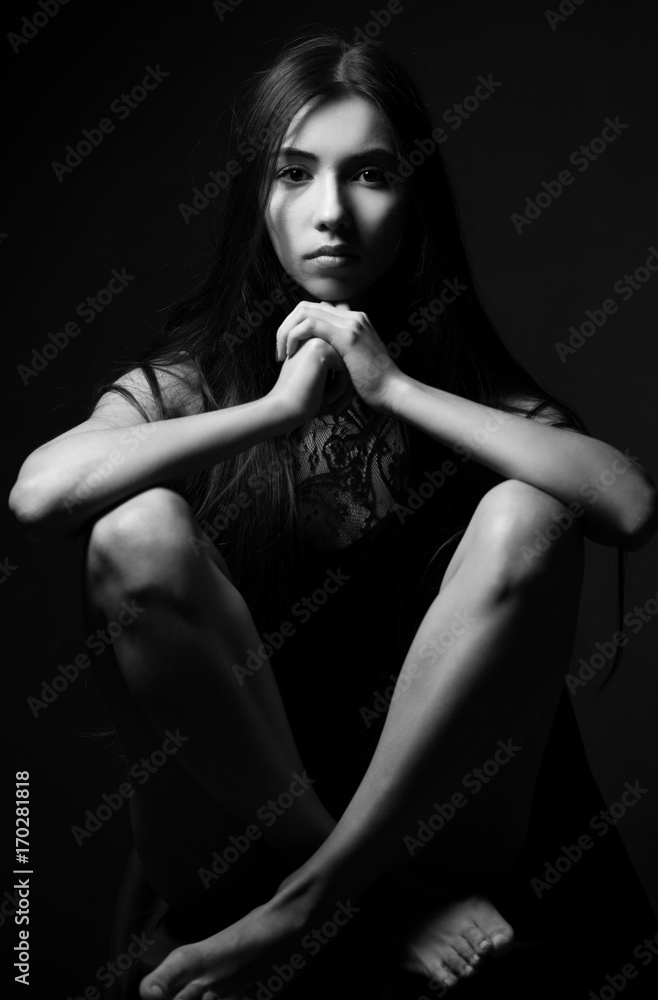 Beauty portrait of a young beautiful brunette girl with long straight flying hair. Magnificent hair. Black and white. Beauty portrait of a young beautiful brunette girl with long straight flying hair. Magnificent hair. Black and white.