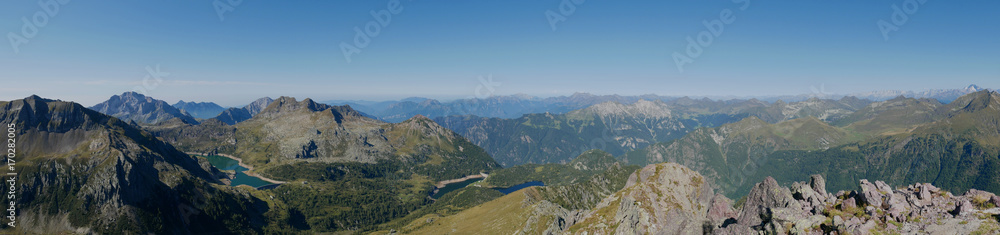 Panoramic view of lake Colombo basin and dam on the Bergamo Alps, northern Italy. Panoramic view of lake Colombo basin and dam on the Bergamo Alps, northern Italy.