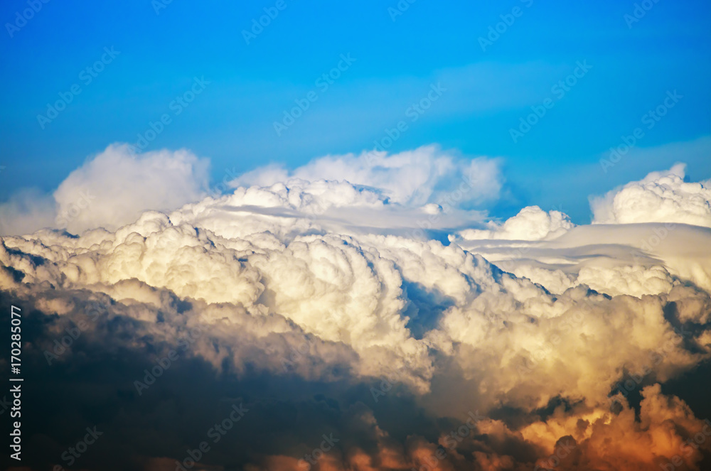 Fototapeta premium Cumulus clouds in the blue sky after a thunderstorm. Beautiful natural landscape
