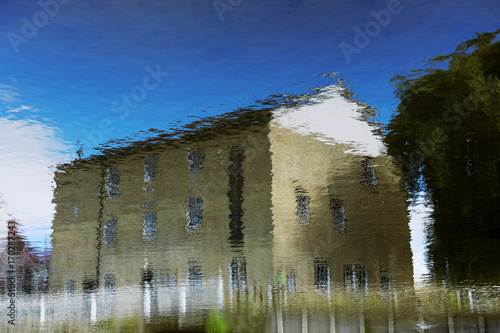 riverside reflection of industrial building