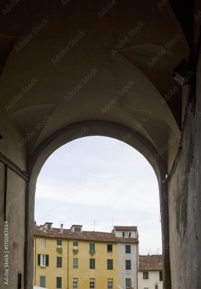 Arch entrance to Anfiteatro square in Lucca, Tuscany, Italy