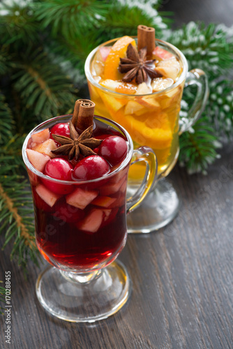 spicy Christmas drinks on wooden table