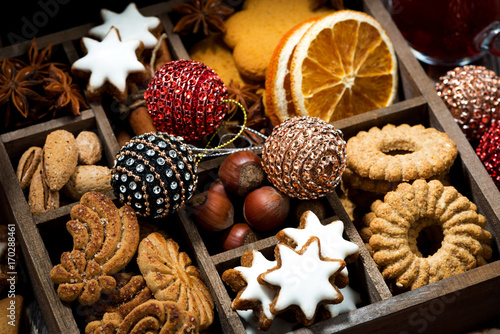 wooden box with Christmas sweets and spices, top view