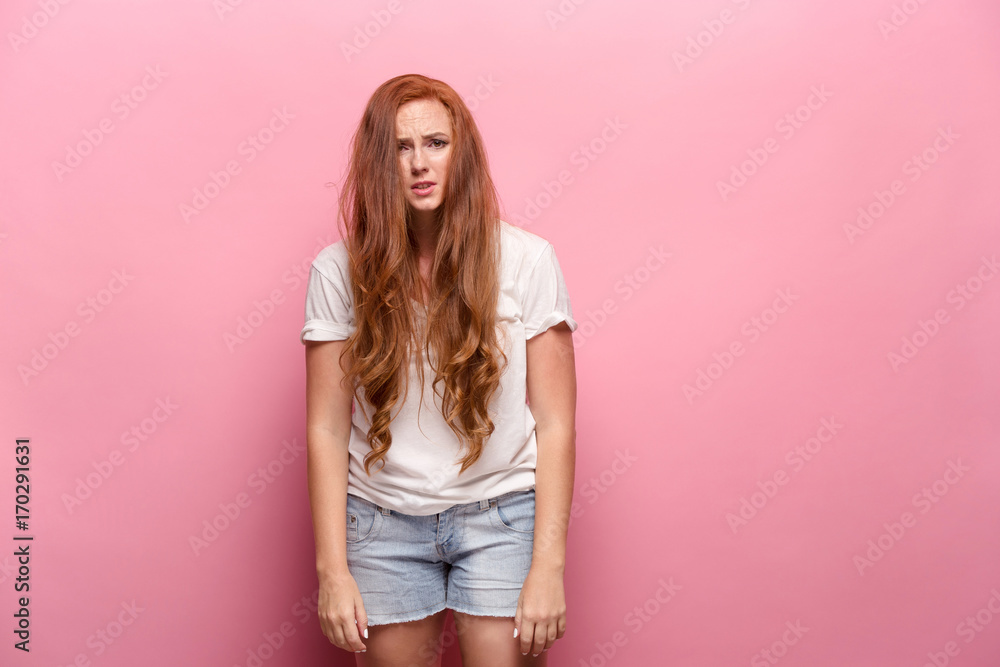 The beautiful woman is offended on pink studio The beautiful woman is offended on pink studio