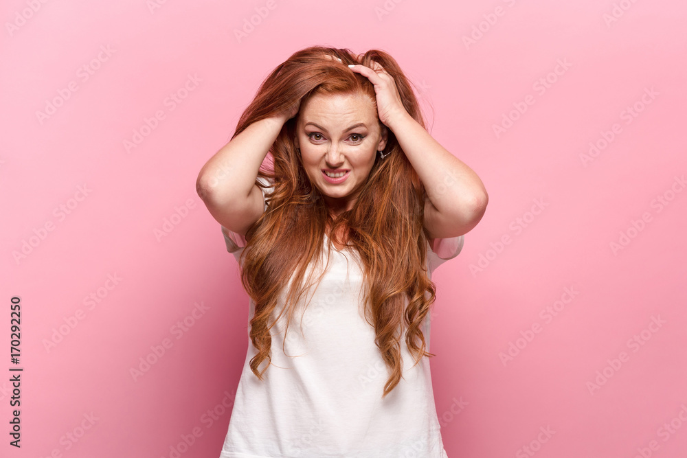 The beautiful woman is offended on pink studio The beautiful woman is offended on pink studio
