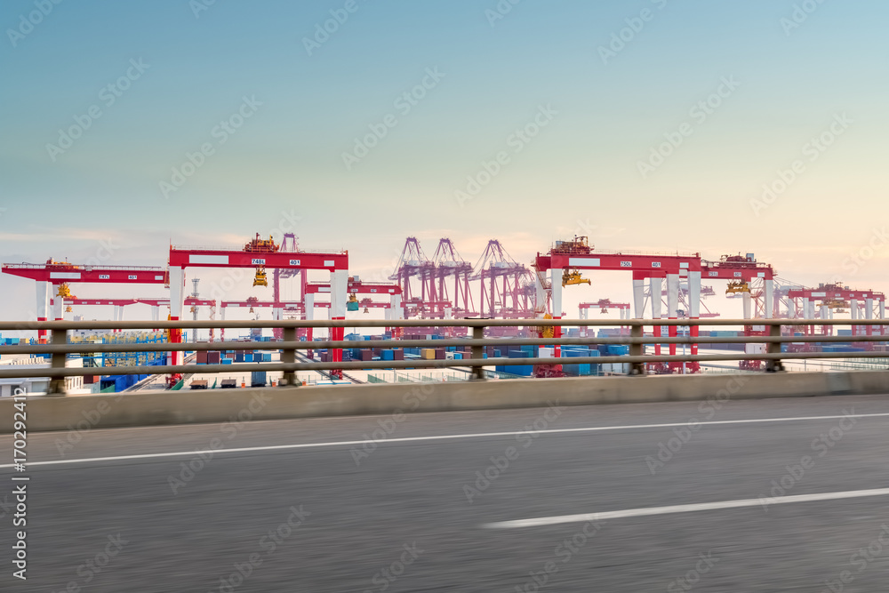 container port with road at dusk