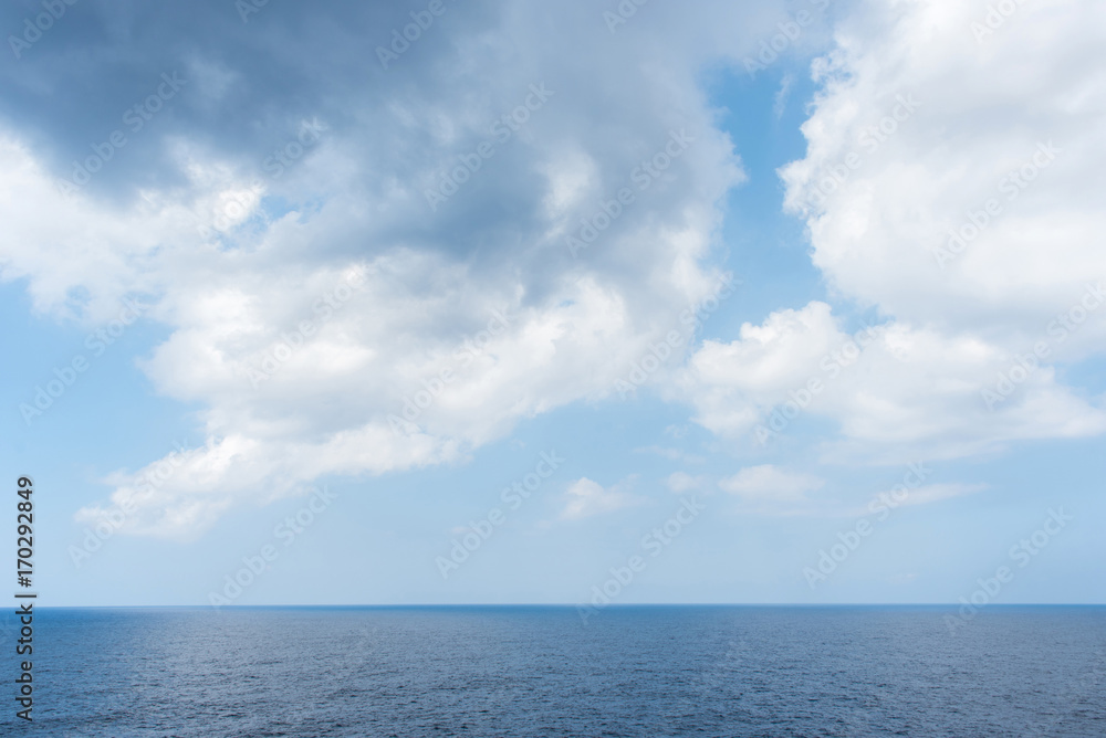 Sea horizon and cloudy sky