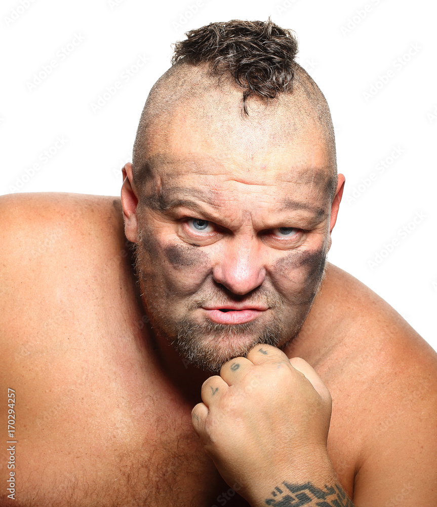 Fototapeta premium Angry, aggressive, bearded man with mohawk
