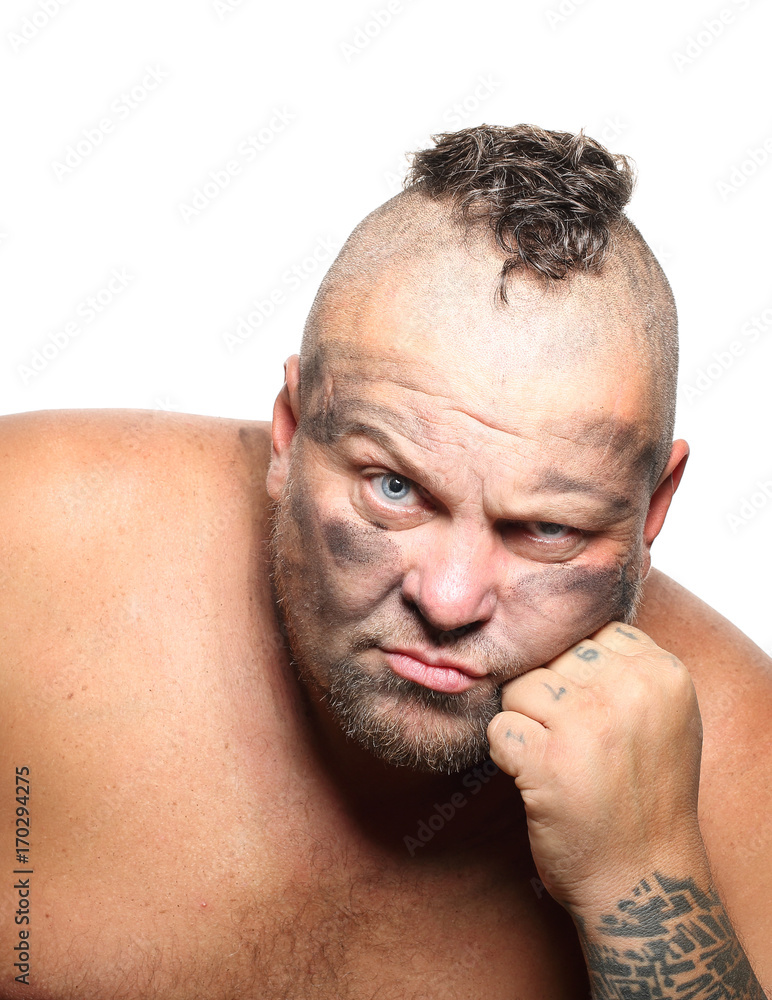 Obraz premium Angry, aggressive, bearded man with mohawk