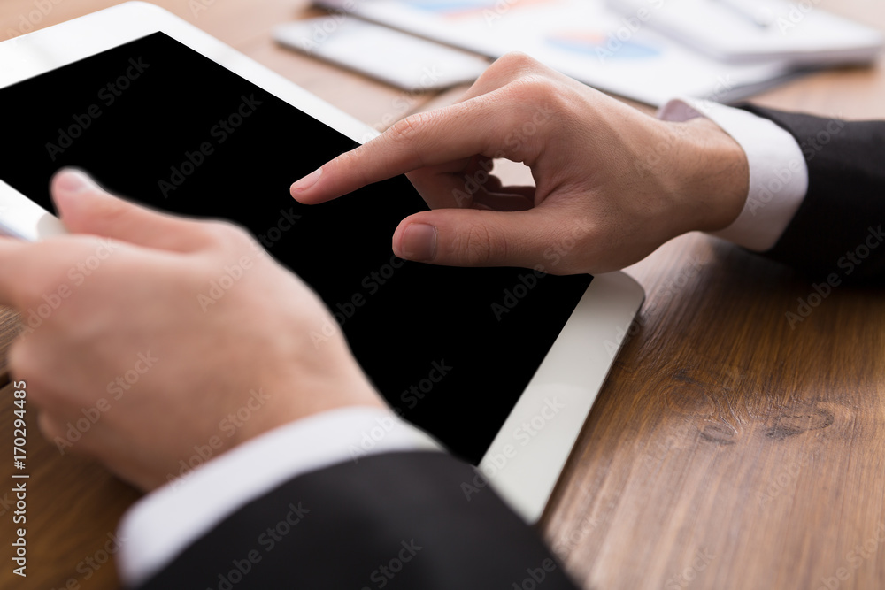 Male using digital tablet, close up, side view, Male using digital tablet, close up, side view,