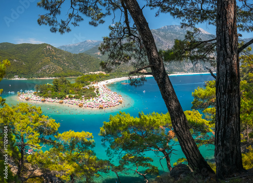 Oludeniz beach full of relaxing people and the Blue Lagoon, Fethiye, Turkey