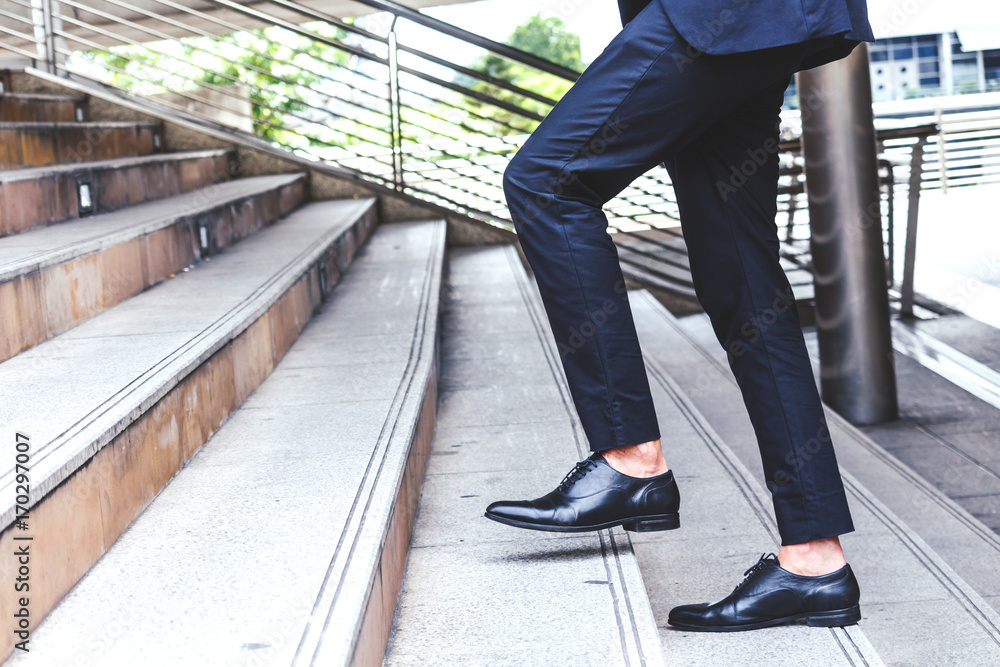 Businessman walking up the stairs