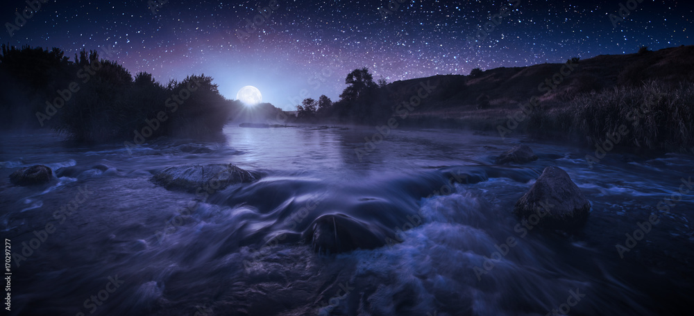 Beautiful starry night above the river