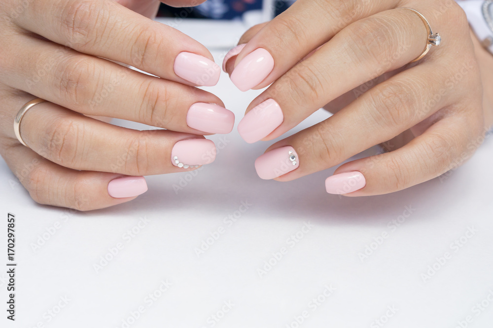 Amazing natural nails. Women's hands with clean manicure. Gel polish applied. Amazing natural nails. Women's hands with clean manicure. Gel polish applied.