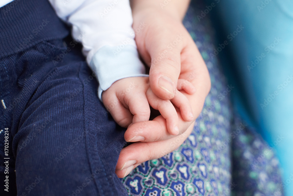 Baby hand with mother hand/Baby hand with mother hand.
