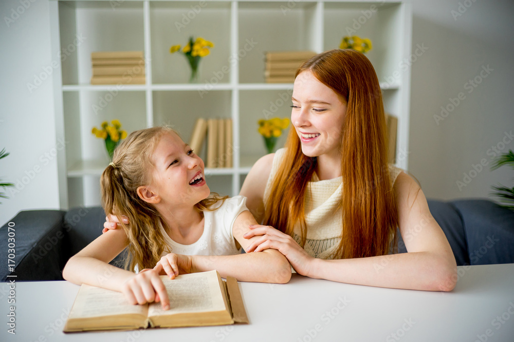 Mother and daughter reading book Mother and daughter reading book