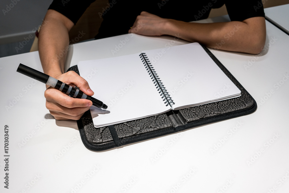 Woman sitting on office desk and planning for project timeline. Woman sitting on office desk and planning for project timeline.