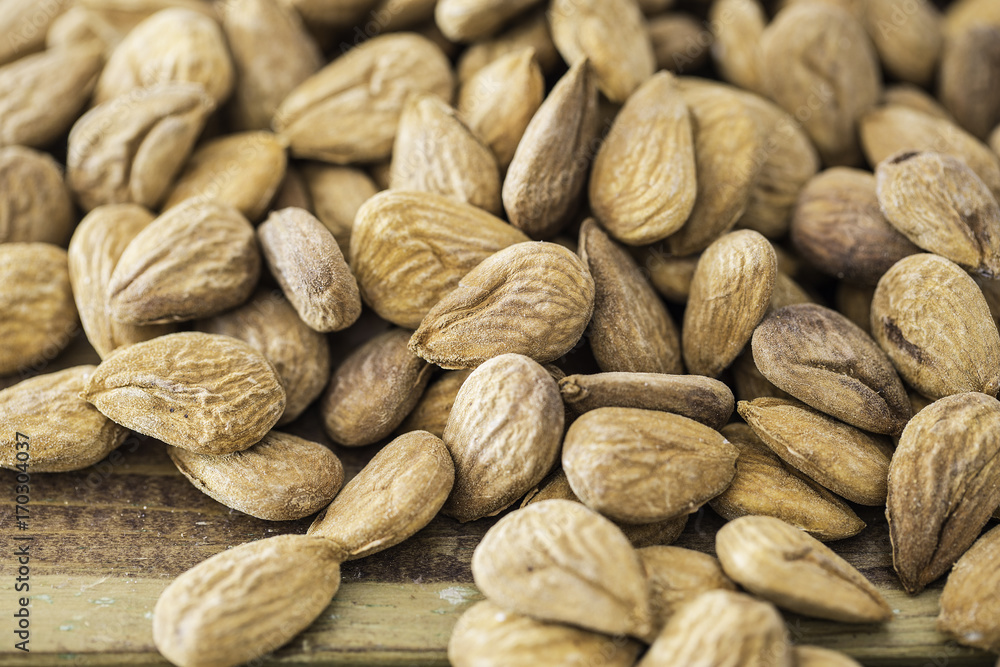 Group of almonds nuts in a wooden table Group of almonds nuts in a wooden table
