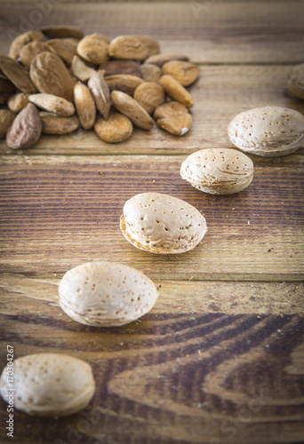 Group of almonds nuts in a wooden table