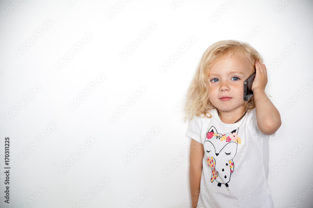 Little beautiful girl with her smart phone Little beautiful girl with her smart phone