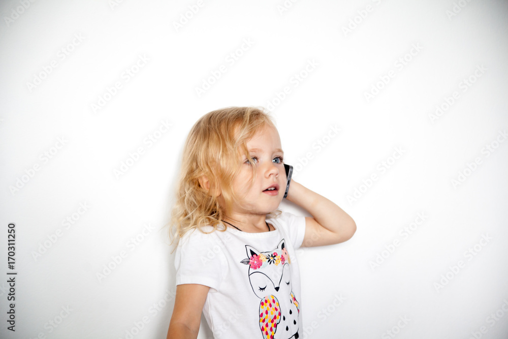 Little beautiful girl with her smart phone Little beautiful girl with her smart phone