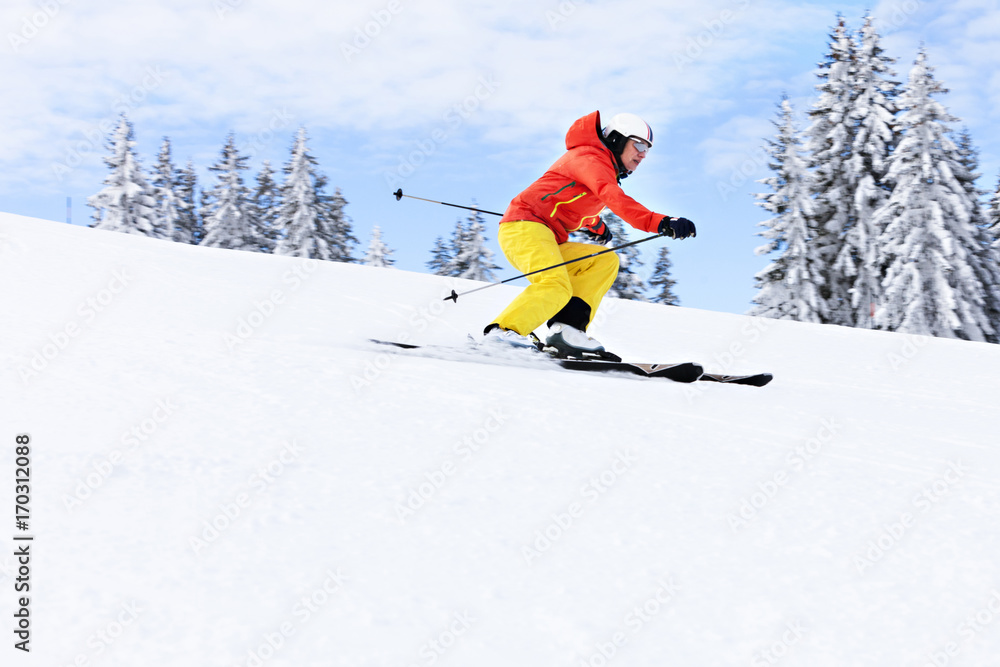 Ski holiday, Woman skiing downhill, Sudelfeld, Bavaria, Germany Ski holiday, Woman skiing downhill, Sudelfeld, Bavaria, Germany