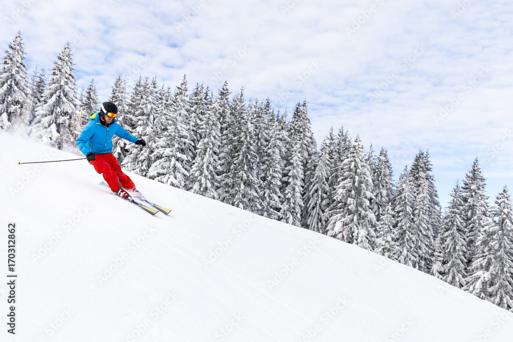 Ski holiday, Woman skiing downhill, Sudelfeld, Bavaria, Germany Ski holiday, Woman skiing downhill, Sudelfeld, Bavaria, Germany