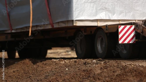 Lorry trucking load wheel close-up, truck transports oversized cargo
