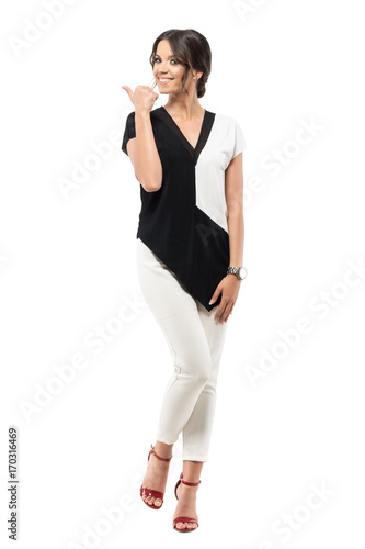 Excited cheerful pretty business woman in suit showing thumb up hand gesture. Full body length portrait isolated on white studio background © sharplaninac